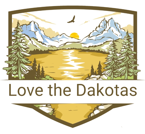 A picture of the mountains and trees with the words " love the dakotas ".