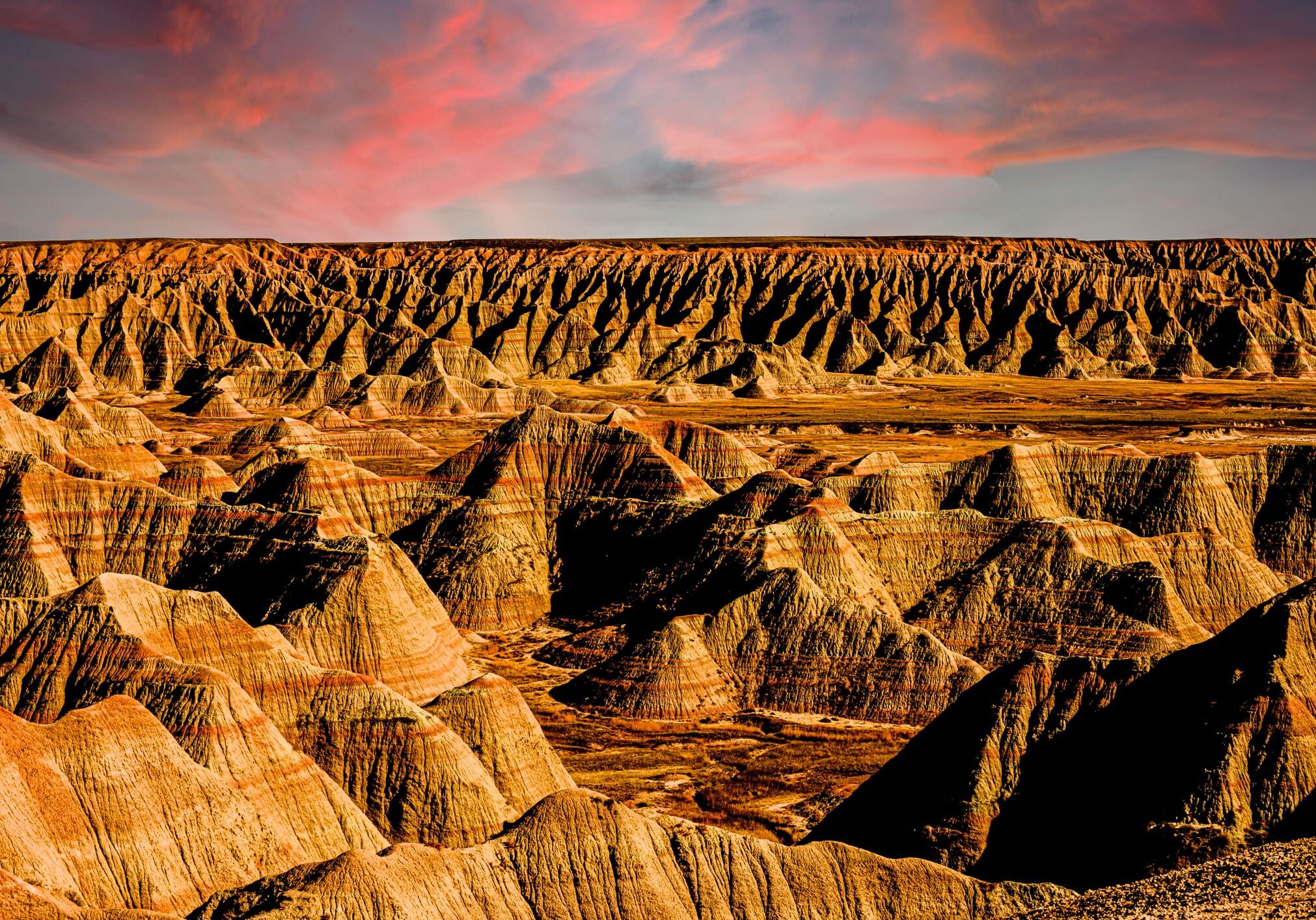 A view of the desert landscape at sunset.