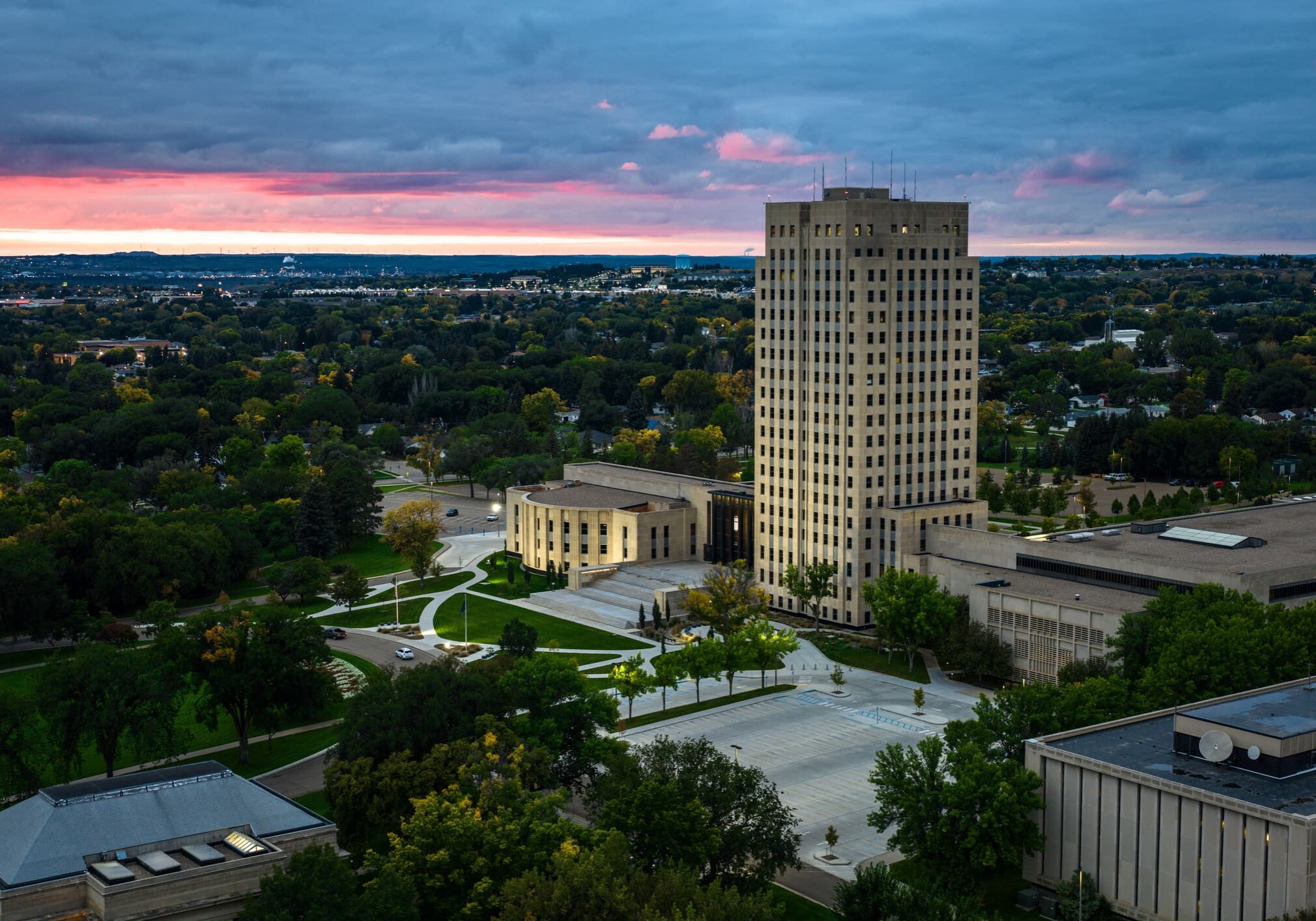 A view of the city from above at sunset.